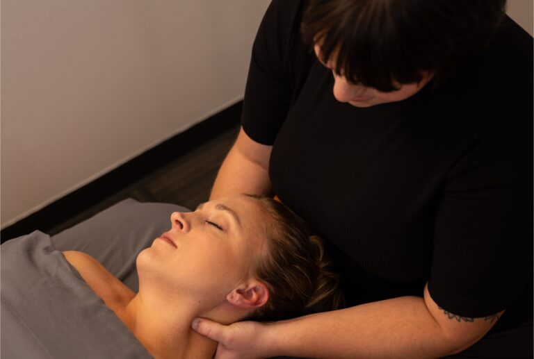 LMT massaging a patients neck